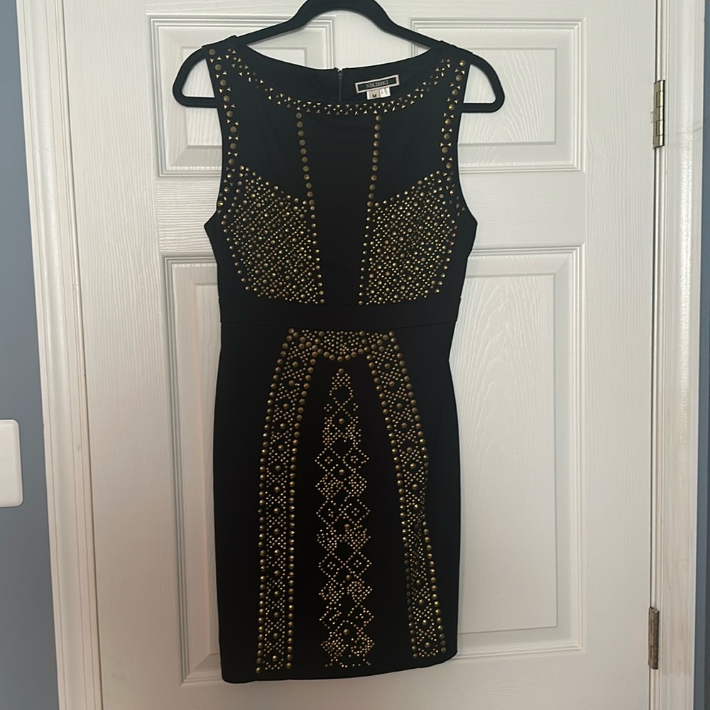 Women’s formal black dress with gold design